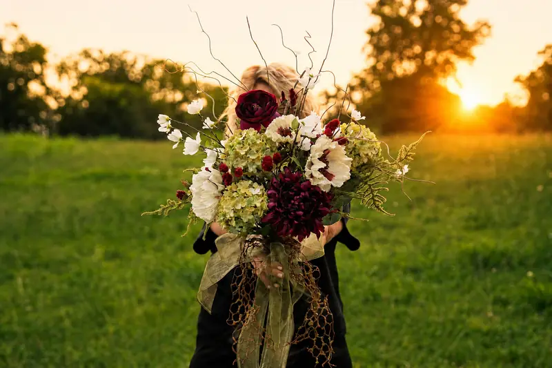 Founder holding a sunset field bouquet