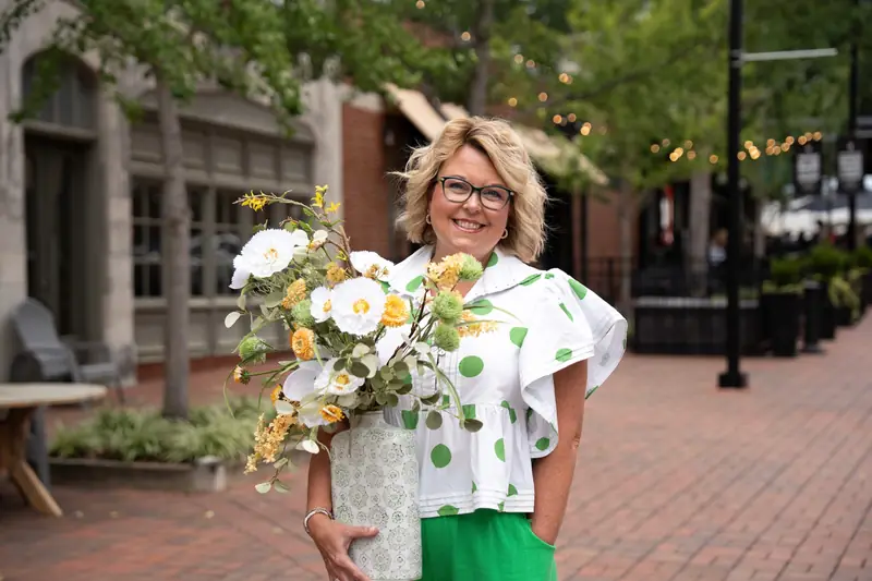 Floravend founder with an arrangement